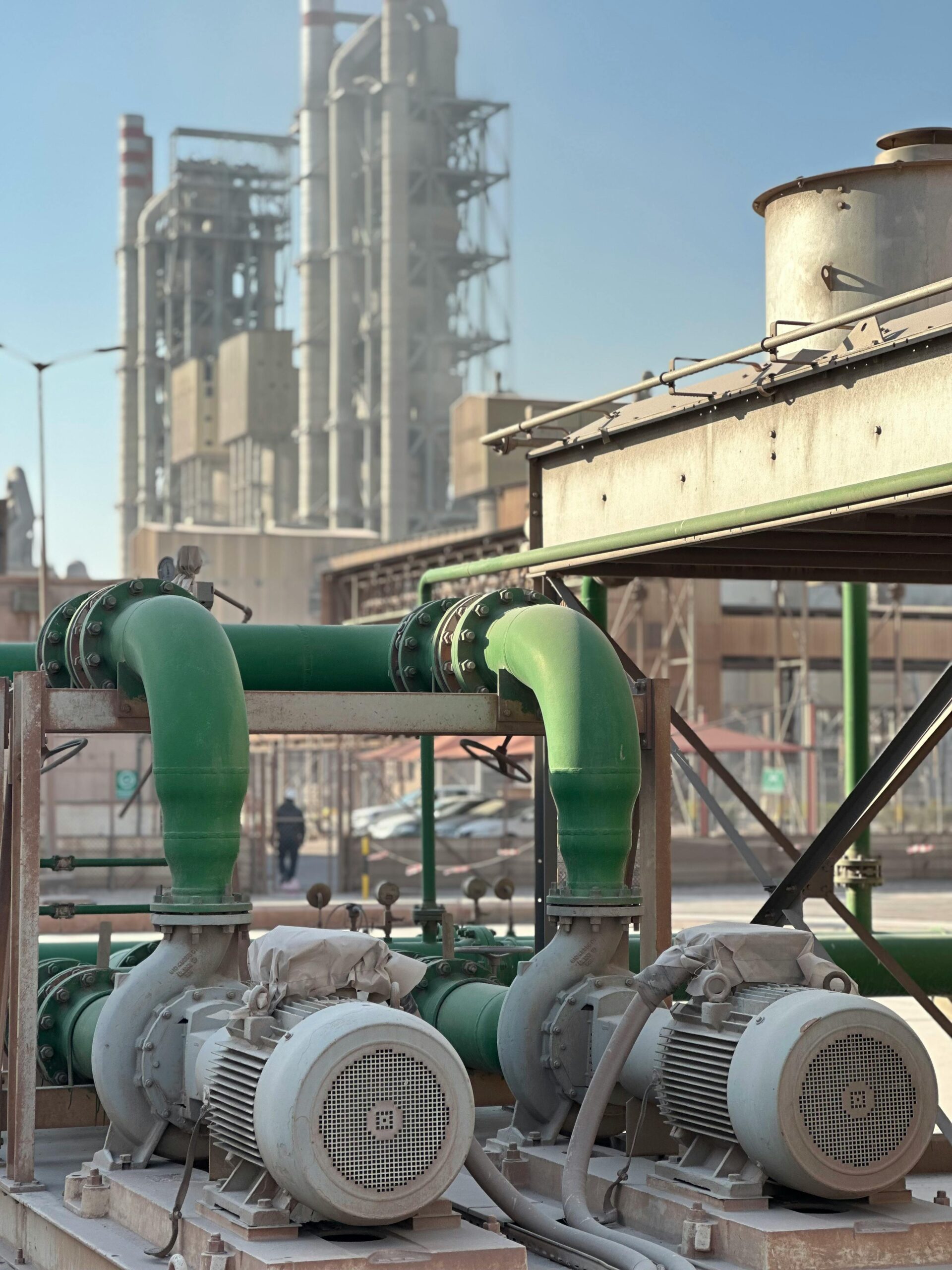 Close-up of industrial pumps at a Dubai power plant, showcasing engineering and industry.